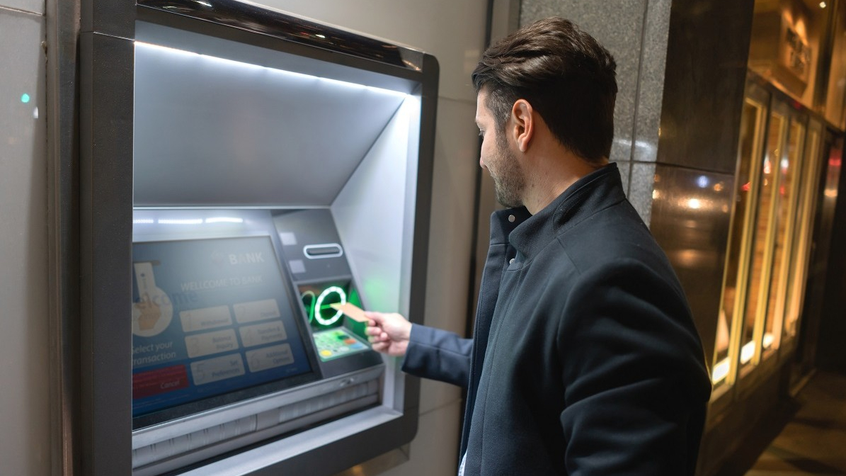 Image of person using ATM/ITM. QSI, Inc. is a full-service provider of ATMs, ITMs, self-service technology and branch solutions, physical and logical security, maintenance and cash management for financial institutions, specializing in the community marketplace.