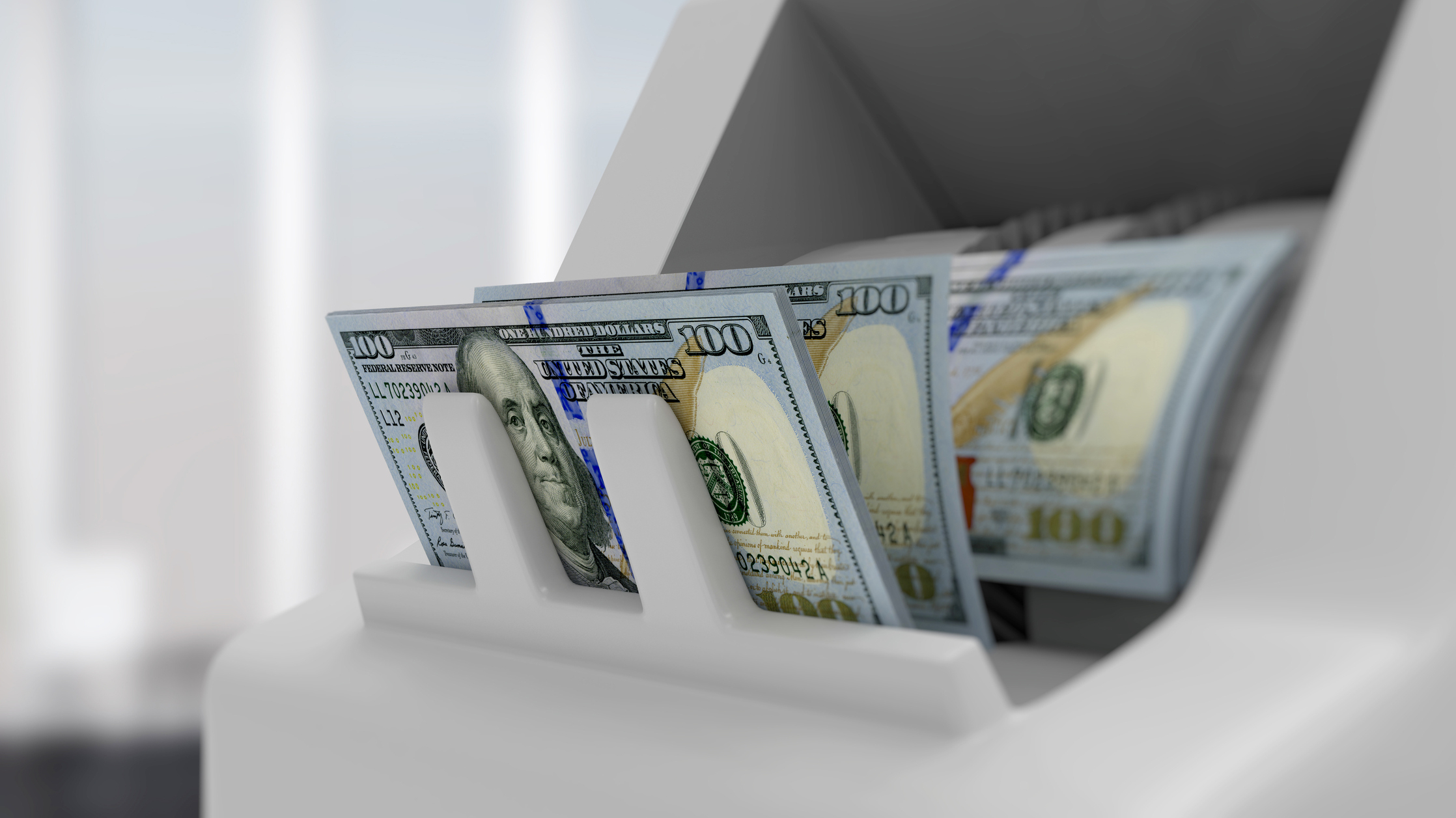 Image of cash in a TCR. QSI, Inc. is a full-service provider of ATMs, ITMs, self-service technology and branch solutions, physical and logical security, maintenance and cash management for financial institutions, specializing in the community marketplace.